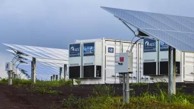 A storage battery surrounded by solar panels in Hawai`i